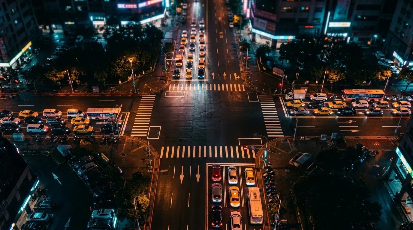 Traffic stopped at a junction at night
