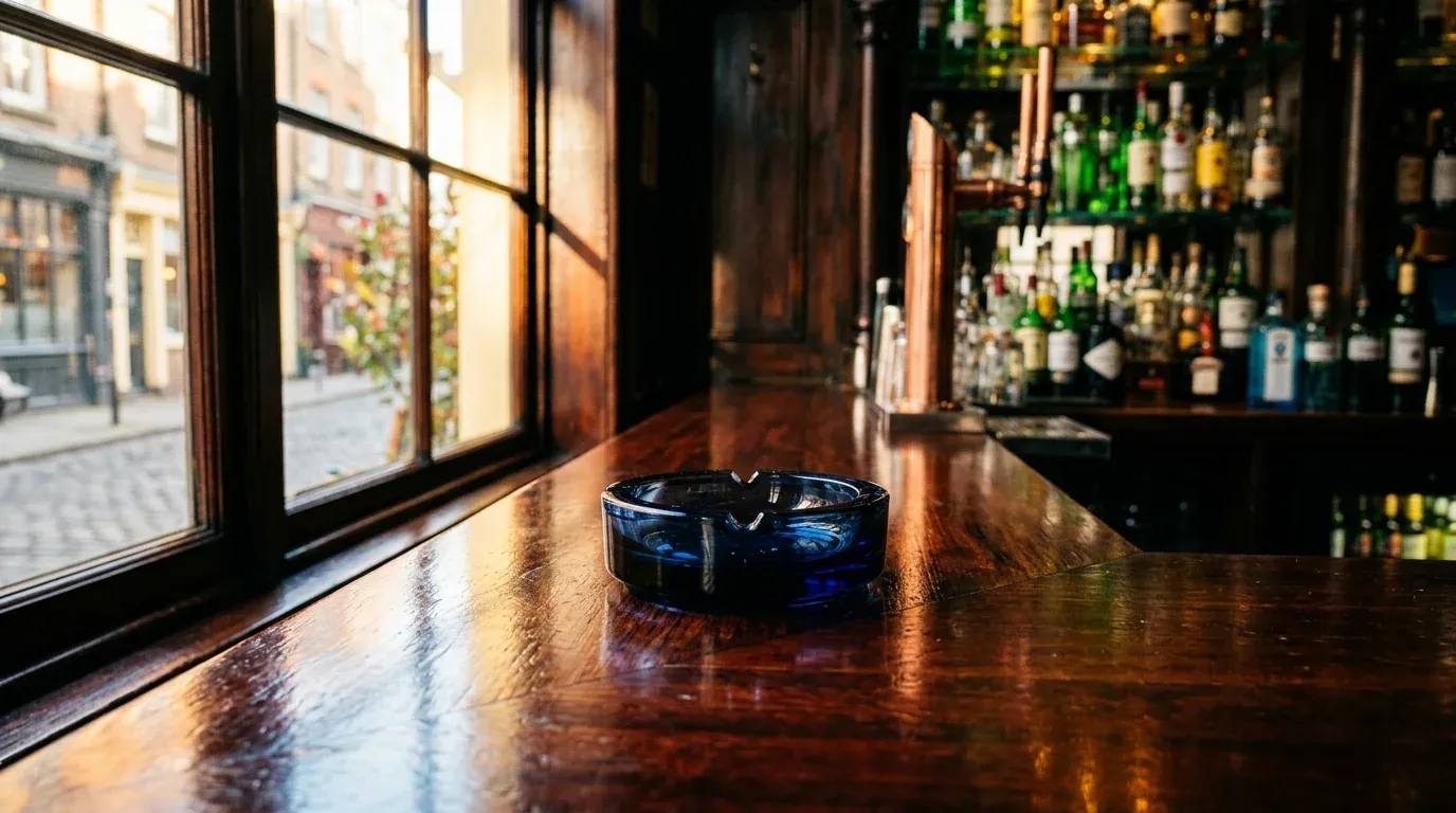An unused ashtray on a clean bar