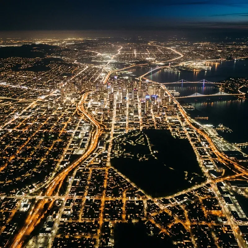 Aerial view of a lit city grid at night